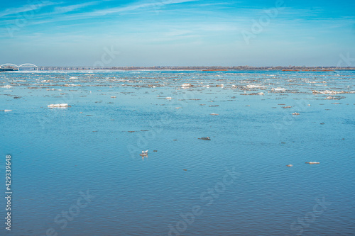 ice drift on the river. Ice drift on a river with blue high water and big wate. flood  high water in early spring on the big river