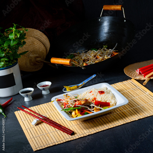 fried sweet and sour chicken with vegetables photo