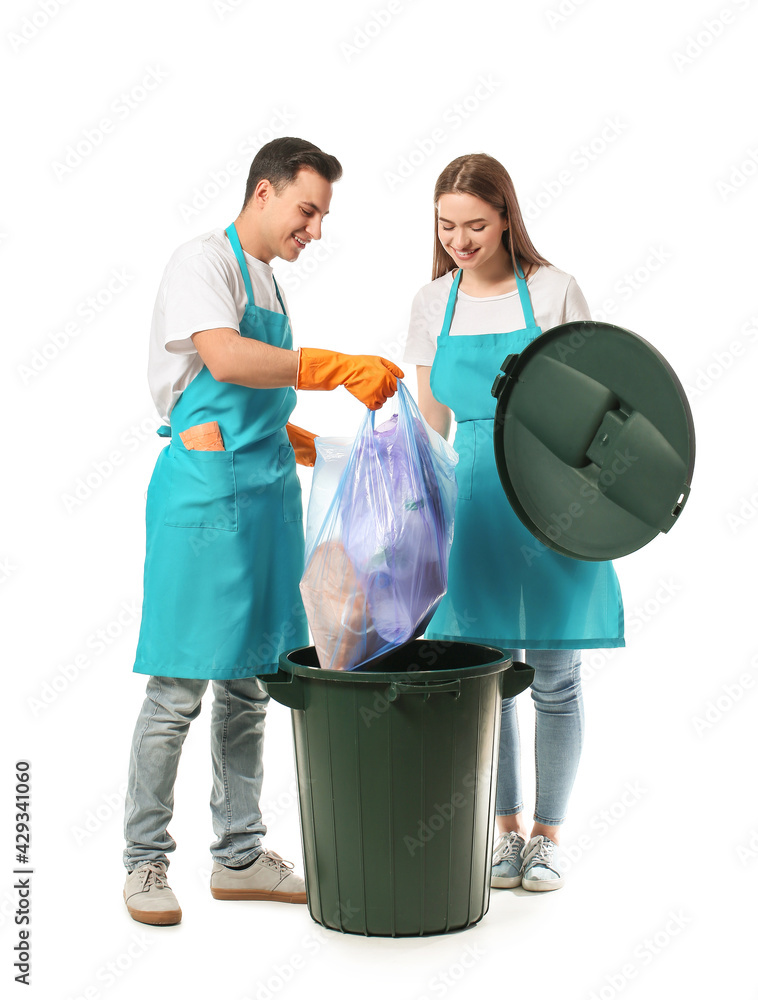 Janitors putting garbage in trash bin on white background Janitors putting garbage in trash bin on white background
