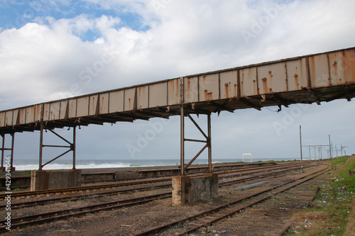 Disused Railway Tracks Passing under a Metal Bridge