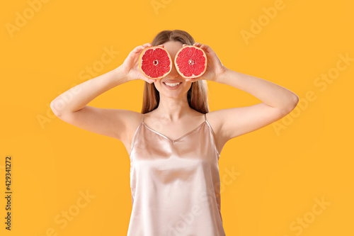 Funny young woman with grap...