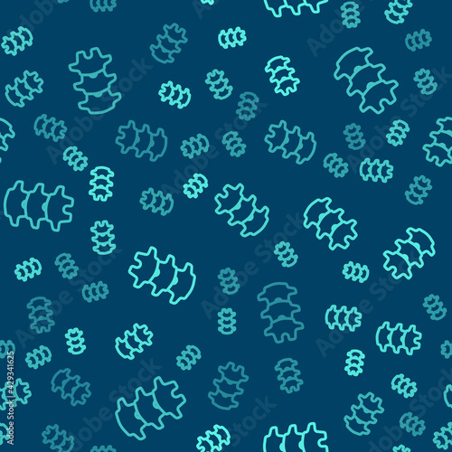 Green line Human spine icon isolated seamless pattern on blue background. Vector