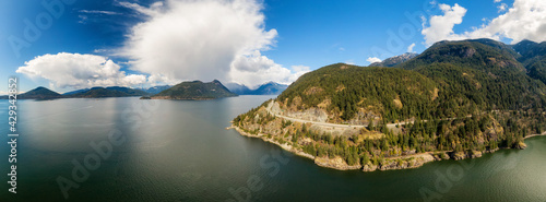 Aerial view of the Sea to Sky Highway in Howe Sound  North of Vancouver  British Columbia  Canada. Taken during a sunny spring day. Panorama Background