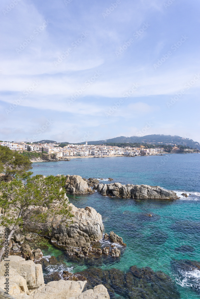 View of greenish crystalline waters in front of the town of CALELLA DE PALAFRUGELL View of greenish crystalline waters in front of the town of CALELLA DE PALAFRUGELL