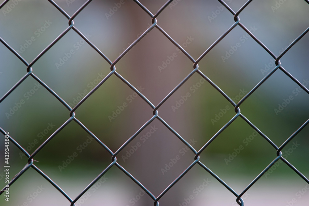 Chain wire mesh fence links macro close up shot shallow depth of field