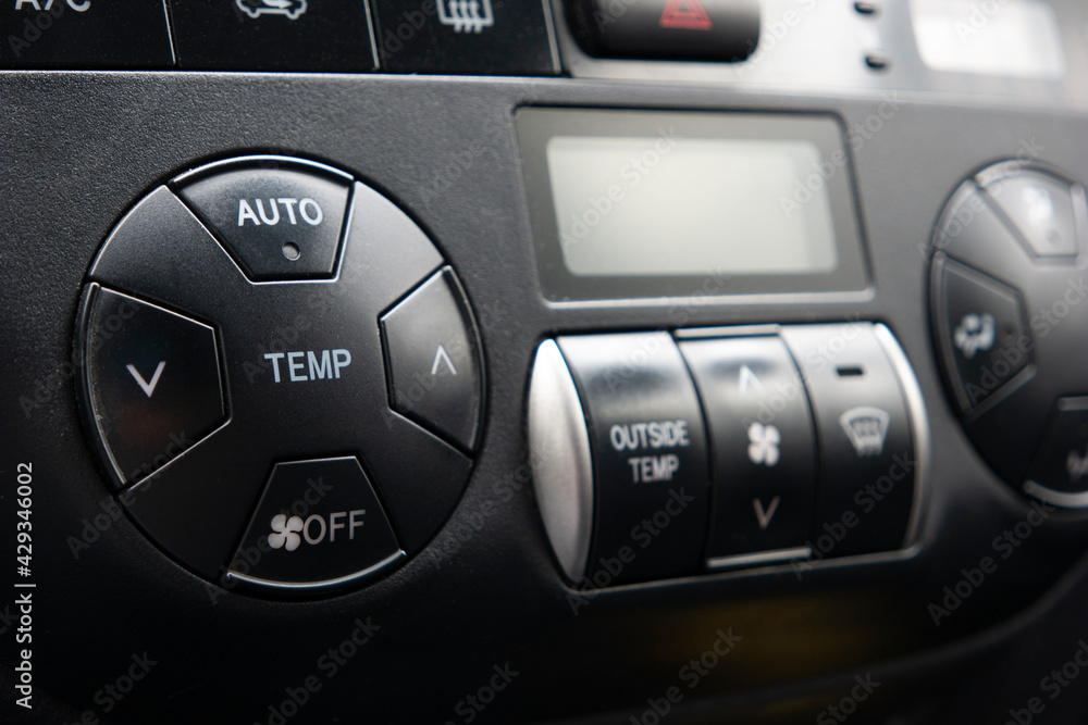 Generic car automatic climate control black plastic dials close up shot Generic car automatic climate control black plastic dials close up shot