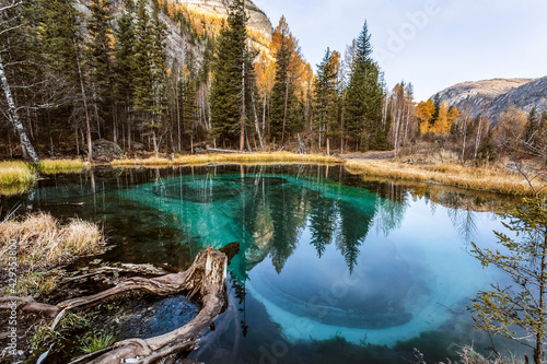 A unique natural phenomenon - turquoise thermal lake in Ulagan district near the village of Aktash in autumn. Altai Republic, Russia © vesta48