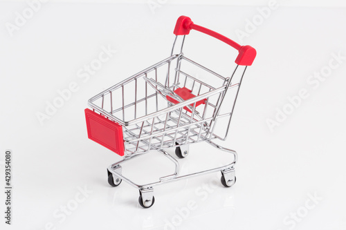 Empty metallic supermarket shopping cart side view isolated. Realistic supermarket basket, retail pushcart vector illustration stock illustration