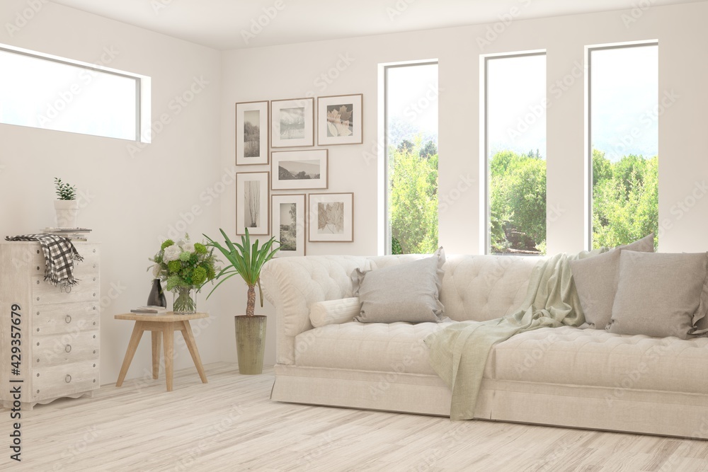 Fototapeta premium White living room with sofa and summer landscape in window. Scandinavian interior design. 3D illustration