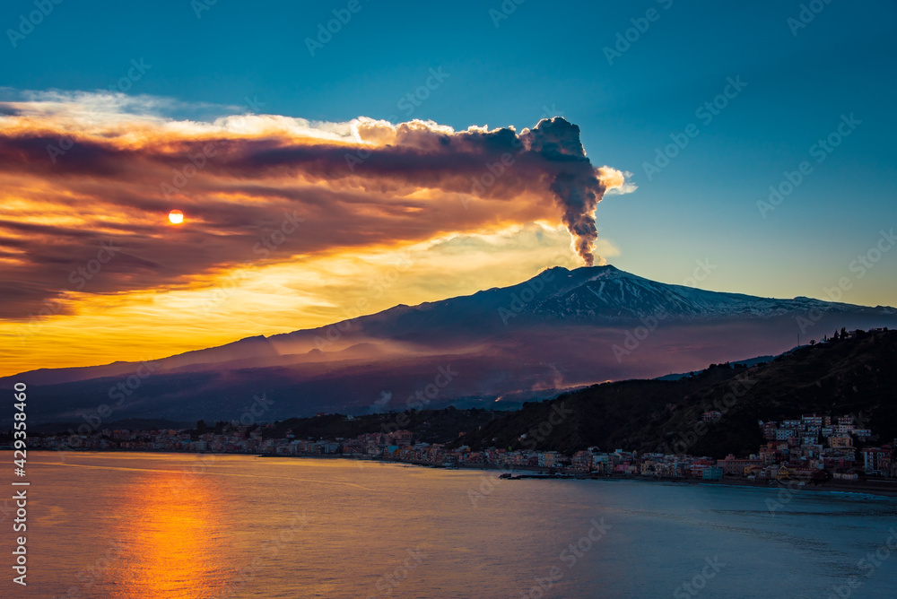 Epic eruption of Mt Etna during sunset. Volcanic eruption by the sea Stock Photo Adobe Stock