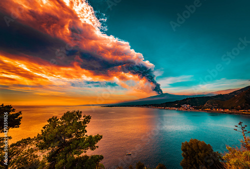 Incredible scenery from the last big eruption of Mount Etna. Fire sky, Fire shades in the sea  photo