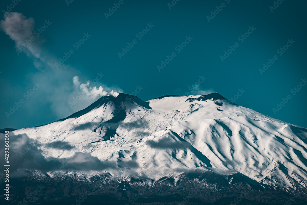 snow covered peaks of Mount Etna - the highest active volcano in Europe 