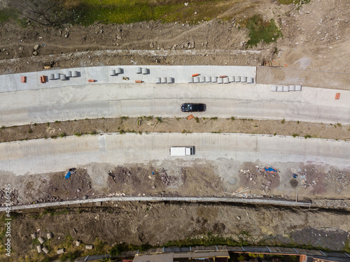 Top view of an avenue under construction. Partially open to allow cars to pass by. photo