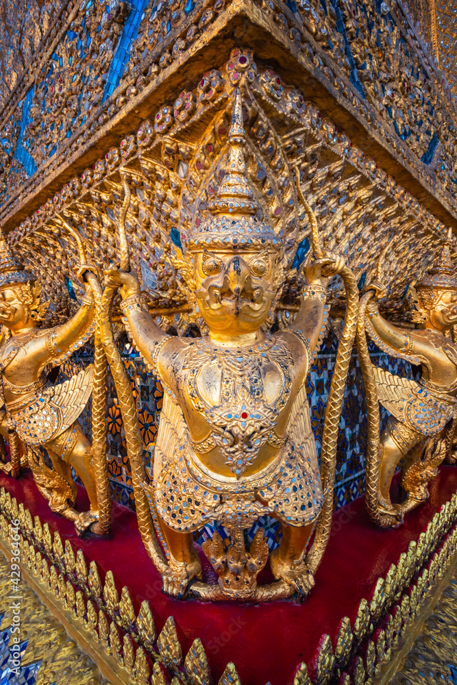 Details on the base of the Wat Phra Kaew's main hall - a sacred temple whic is a part of the Thai grand palace, where it houses an ancient Emerald Buddha