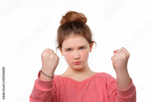 Wallpaper Mural Severe little girl shaking fists and looking at camera. Human emotions, facial expression concept Torontodigital.ca