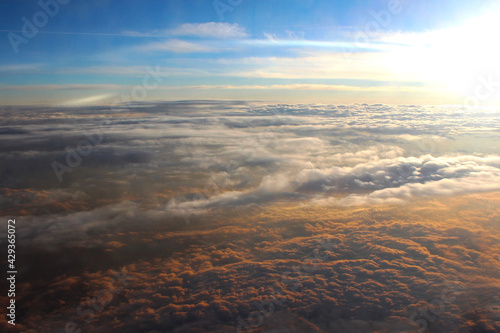 Aerial view of sunset sky and colorful clouds over Mexico. View from airplane. Soft focus