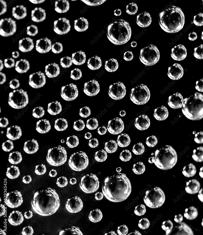 Air balls in water on a black background Air balls in water on a black background