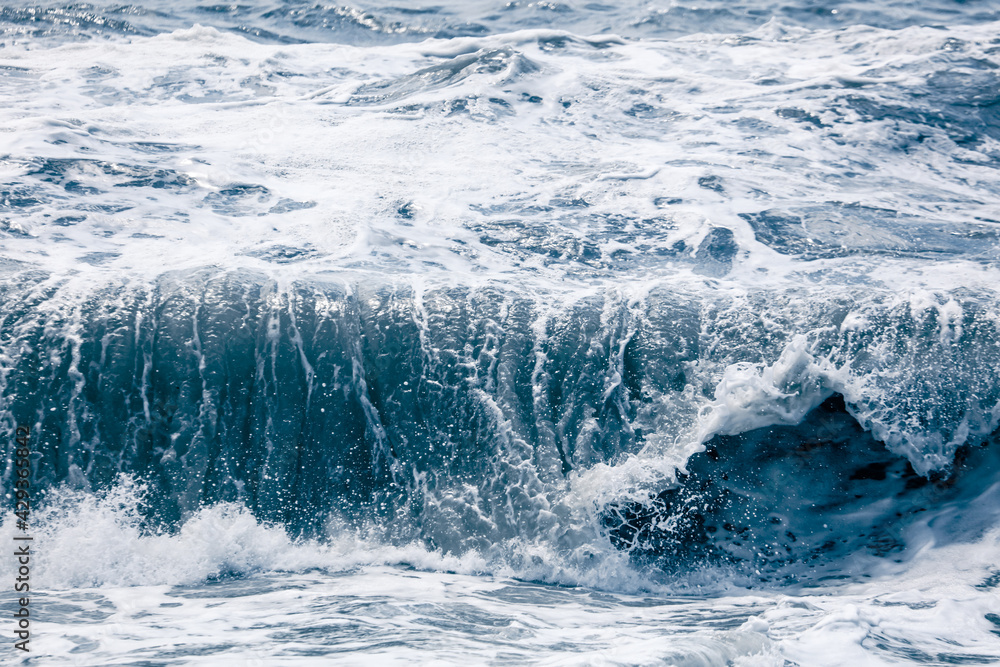 Splashing big waves on the seashore.