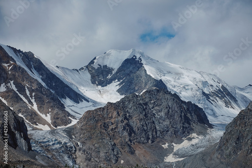 Ice high in the mountains. Aktru glaciers in the Altai mountains clear ice among rocks and mountain peaks the beginning of rivers