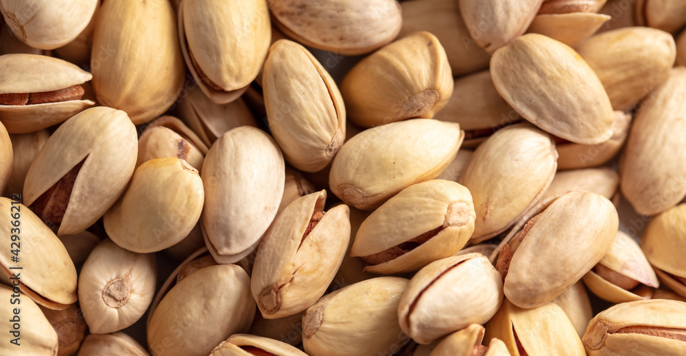 Close-up of fresh pistachio nuts as background. Close-up of fresh pistachio nuts as background.