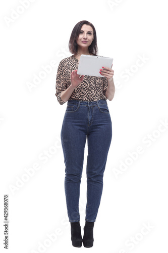 in full growth. attractive young woman with a digital tablet.