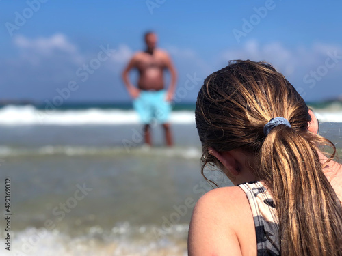 Fényképezés Girl sitting on the beach of Tel Aviv, Israel
