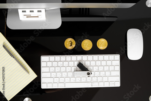 UKRAINE, ROVNO - On April 5: Ledger hardware wallet for cryptocurrency on a black background photo