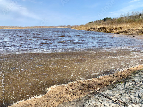 A water-filled sand pit in the spring. Orekhovo-Zuyevsky district, Moscow region, Russia photo