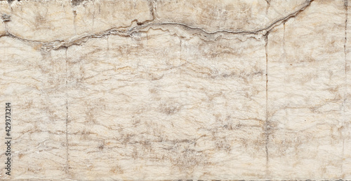 Texture of yellow marble. Stone tile with natural pattern. Marble pavement closeup.