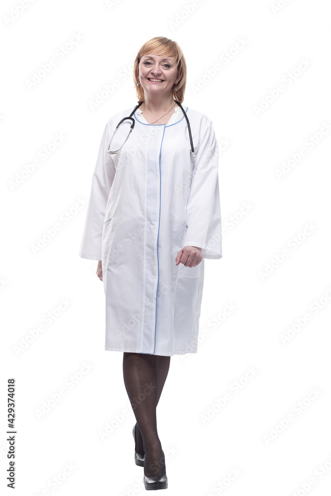 in full growth.friendly female doctor with a stethoscope. in full growth.friendly female doctor with a stethoscope.