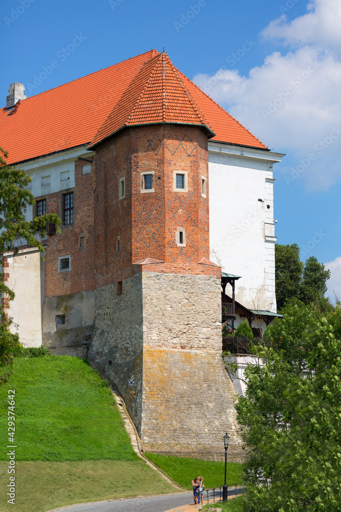 Sandomierz, Poland - July 10, 2020 : Medieval Sandomierz Royal Castle, built on a slope of Vistula River by Casimir III the Great. Gothic tower known as "Kurza Stopka" (Hen's Foot) - obrazy, fototapety, plakaty 