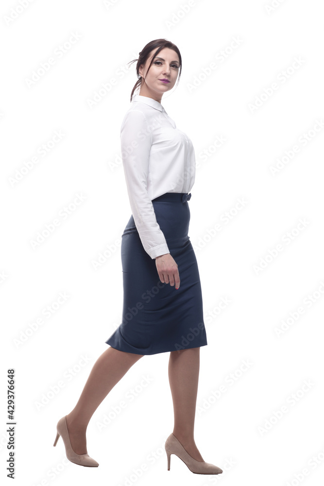 businesswoman in a white blouse and black skirt striding forward. businesswoman in a white blouse and black skirt striding forward.