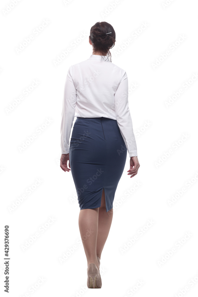 businesswoman in a white blouse and black skirt striding forward. businesswoman in a white blouse and black skirt striding forward.