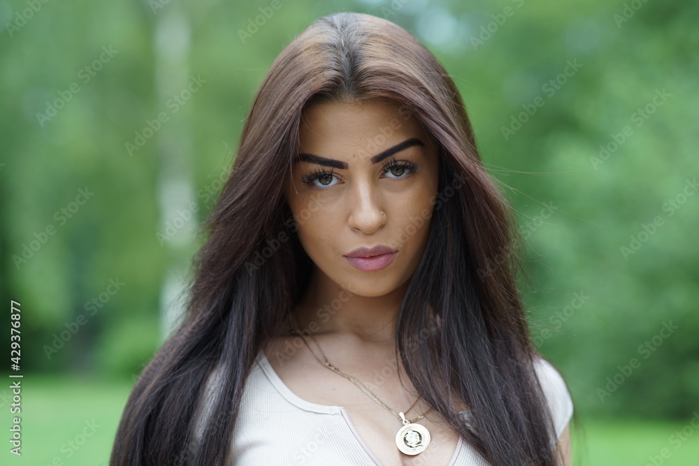 Portrait of a young beautiful girl in the park Portrait of a young beautiful girl in the park
