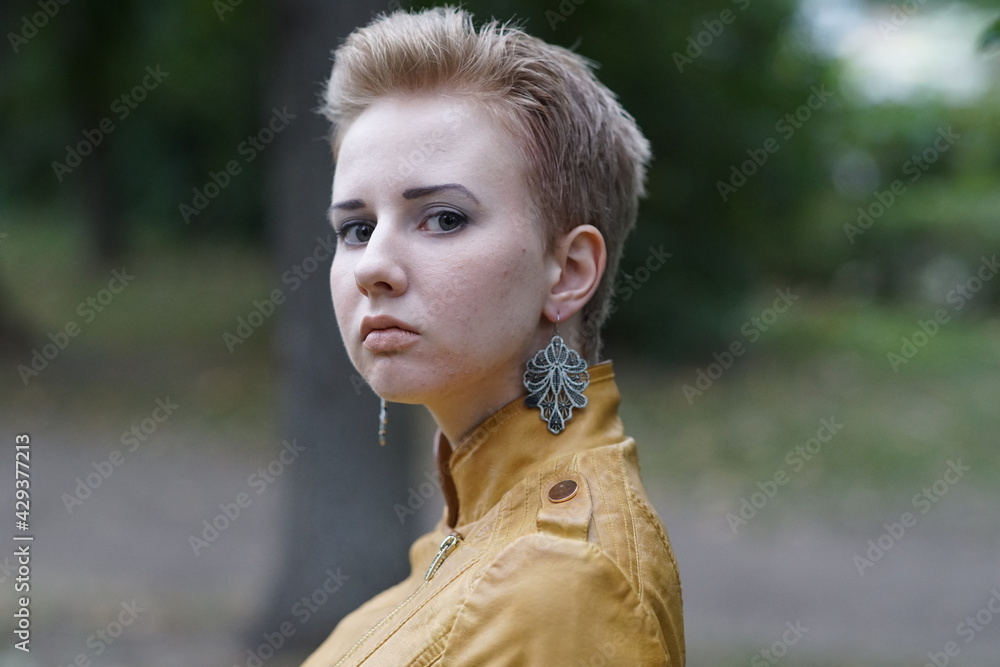 Portrait of a young beautiful girl in the park