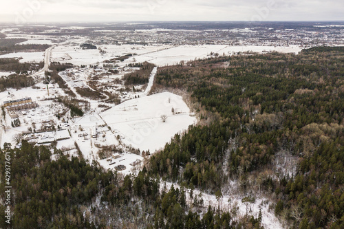 Aerial view of Mezvalde village and Riezupe river nature park in winter day, Latvia.  photo