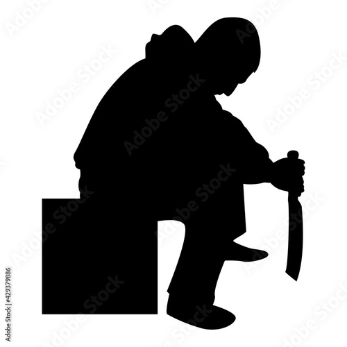 Silhouette man with sword machete cold weapons in hand military man soldier serviceman in positions hunter with knife fight poses strong defender warrior concept weaponry sit on box black color 
