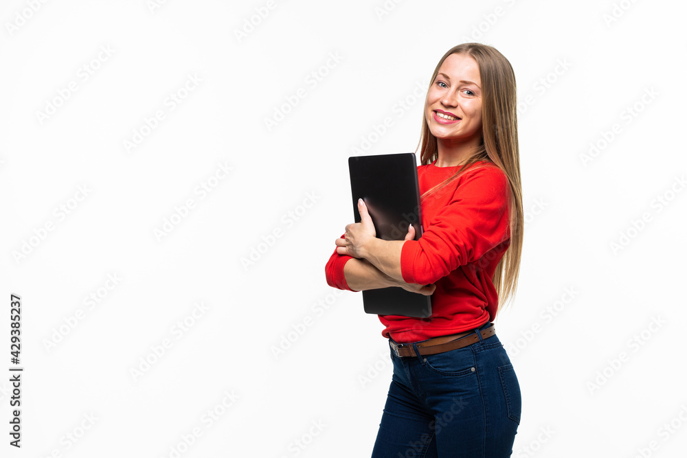 Young smiling confident woman using laptop computer and looking camera isolated over white background Young smiling confident woman using laptop computer and looking camera isolated over white background
