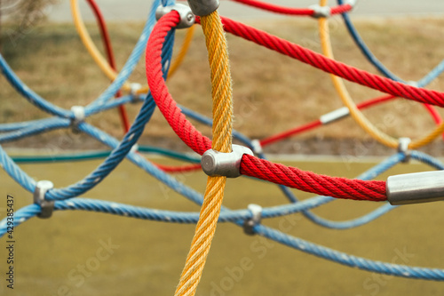 Colorful ropes on the sports ground. Connections of rope ropes for training.