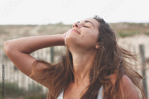 Successful happy smiling pretty Spanish girl in a relaxed atmosphere