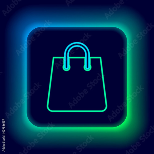 Glowing neon line Handbag icon isolated on black background. Shopping bag sign. Woman bag icon. Female handbag sign. Glamour casual baggage. Colorful outline concept. Vector