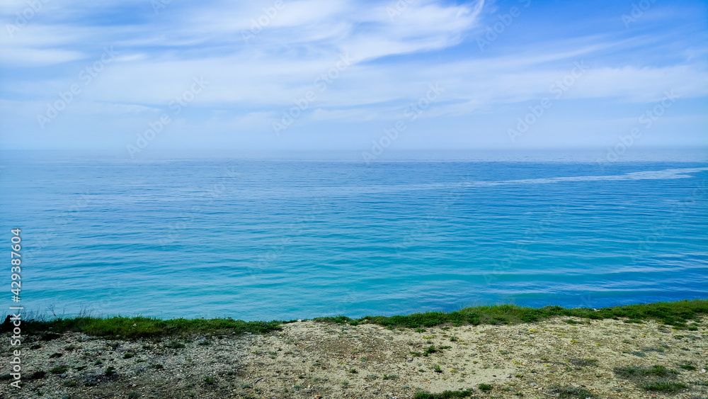 Seascape morning calm sea with spring shore. High quality photo