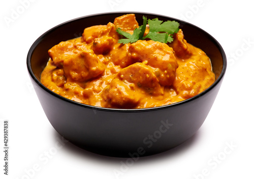 Black ceramic bowl of Traditional Chicken Curry isolated on white background with clipping path embedded