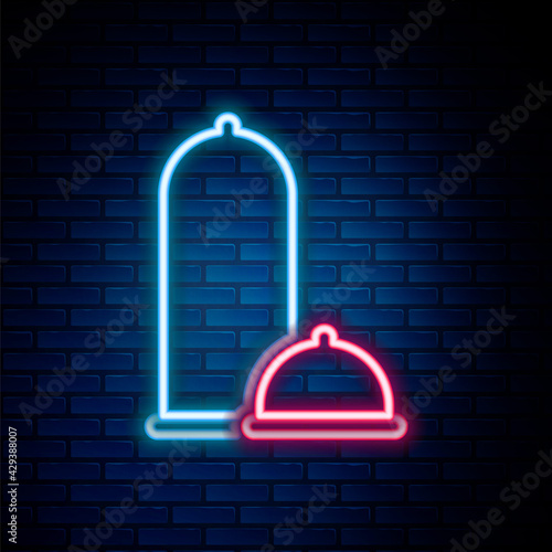 Glowing neon line Condoms safe sex icon isolated on brick wall background. Safe love symbol. Contraceptive method for male. Colorful outline concept. Vector