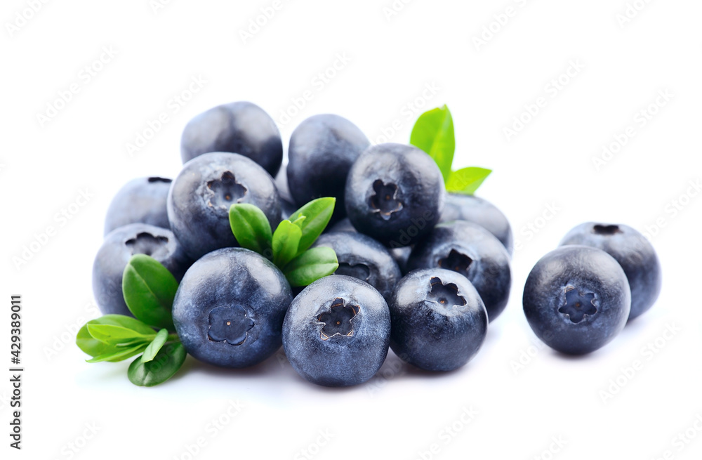 Sweet blueberries with leaves on white backgrounds. Sweet blueberries with leaves on white backgrounds.