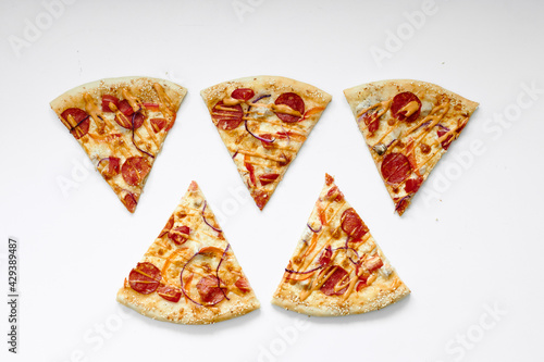 beautifully folded pieces of pizza on a white background