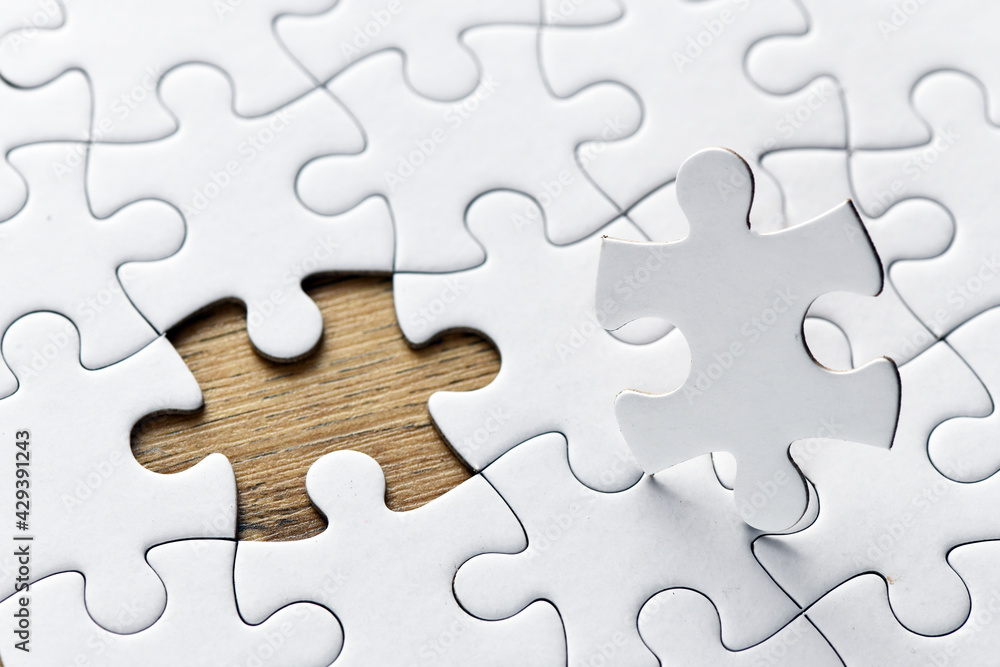 Assembling jigsaw puzzle pieces. Abstract background. Assembling jigsaw puzzle pieces. Abstract background.