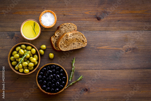 Sliced bread ciabatta with olives and oil. Greek or Italian meal