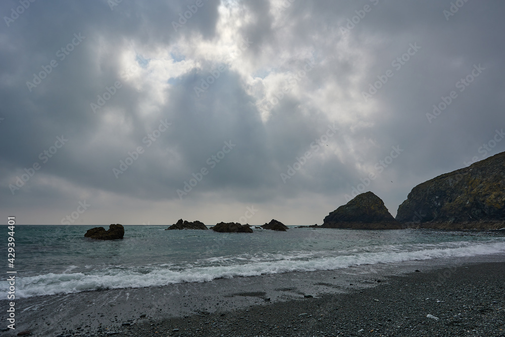 Tra na mBo beach in Ireland. long Irish beach with waves and strong cloudy sky Tra na mBo beach in Ireland. long Irish beach with waves and strong cloudy sky