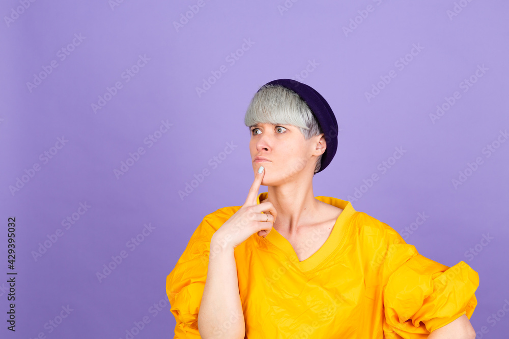 Stylish european woman on purple background thinking worried looking aside concerned Stylish european woman on purple background thinking worried looking aside concerned